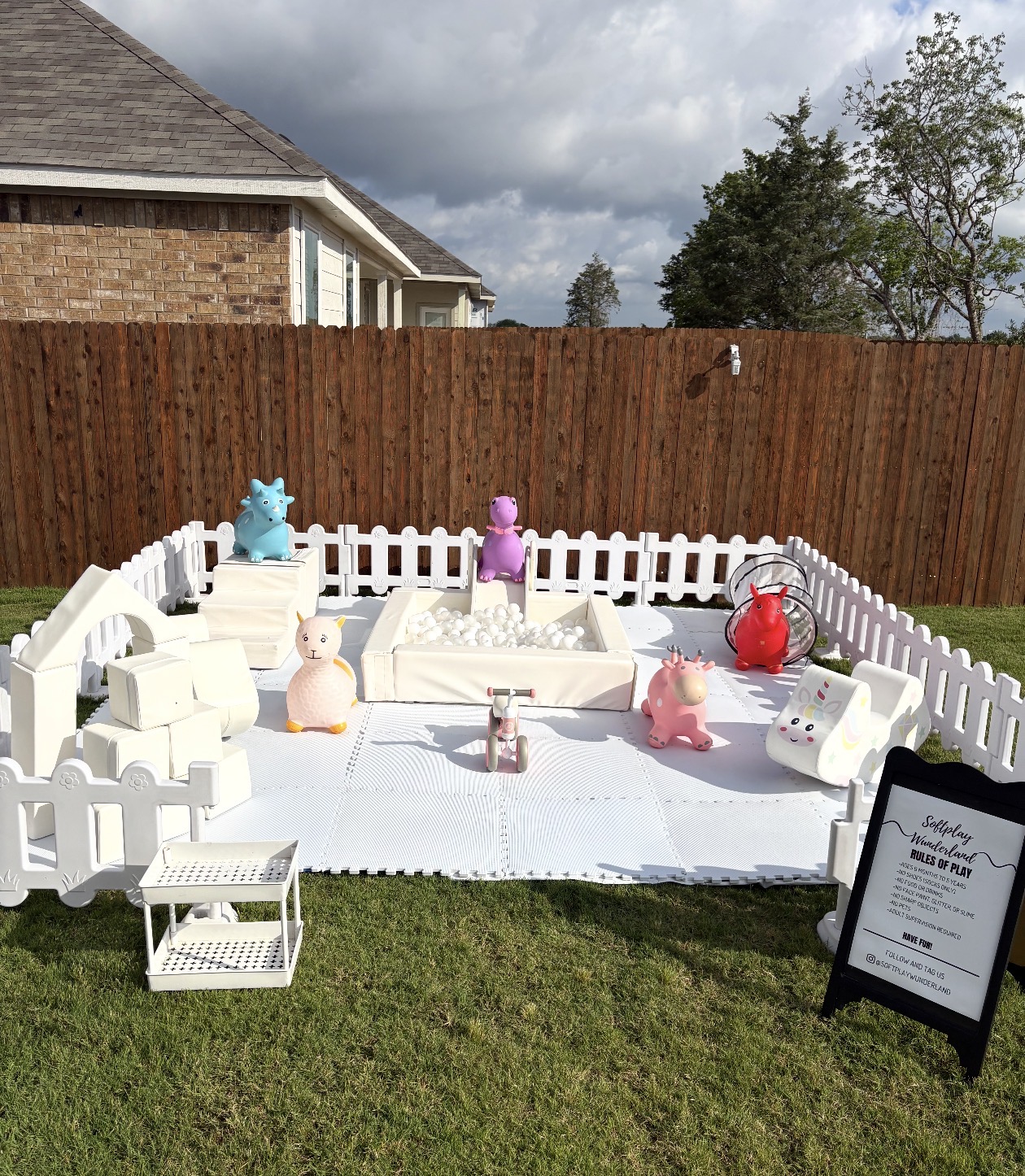 Outdoor backyard soft play with ball pit and colorful hoppers