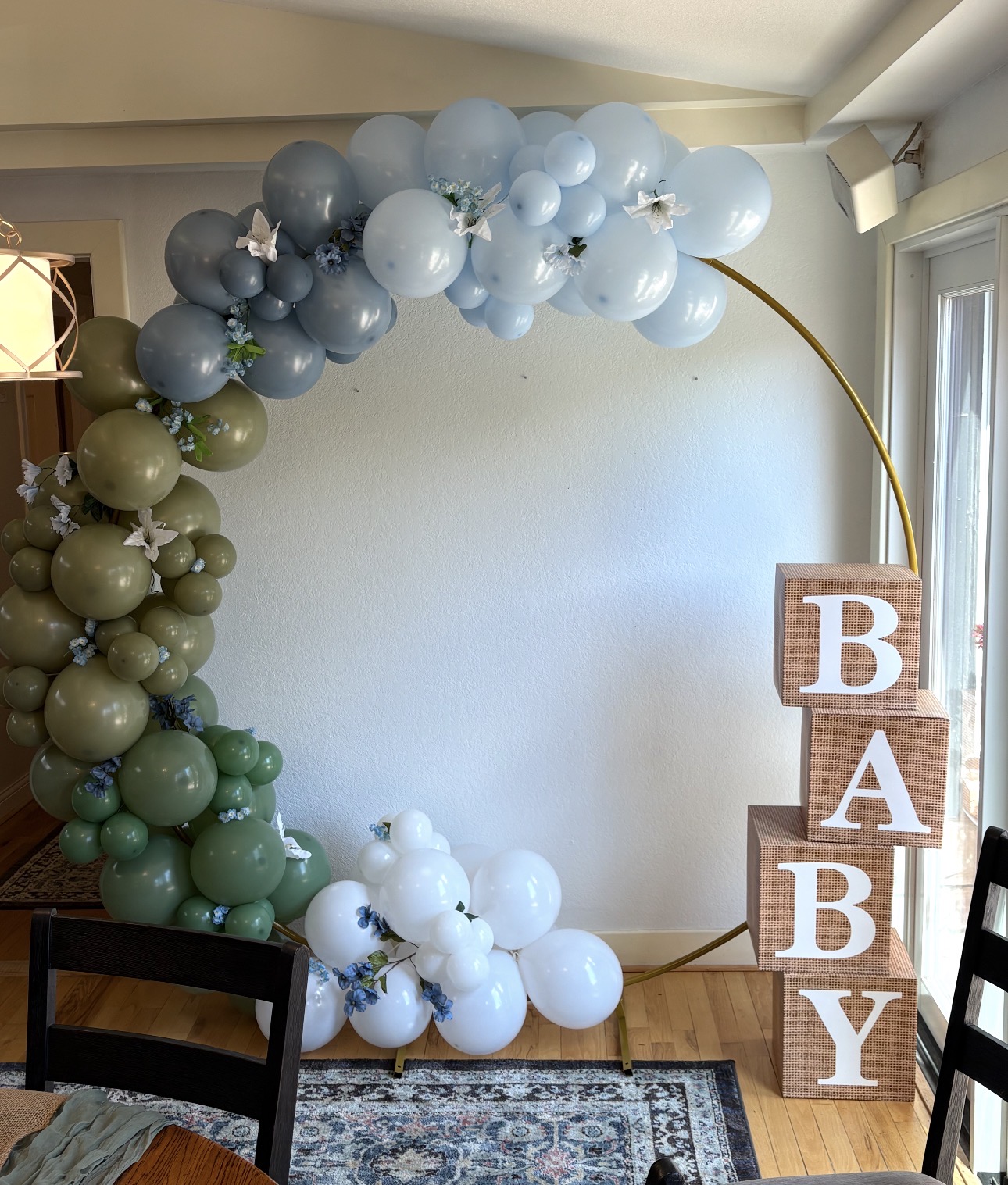 Sage green, dusty blue and white balloon arch with BABY blocks